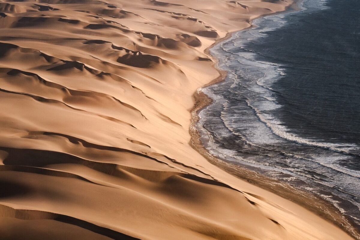a sandy beach with water